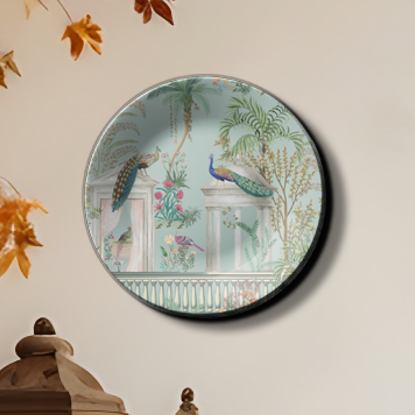 Peacock couple sitting on top ceramic hanging plates on wall